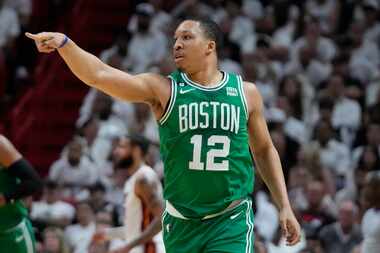 Boston Celtics forward Grant Williams (12) gestures to his teammates during the first half...
