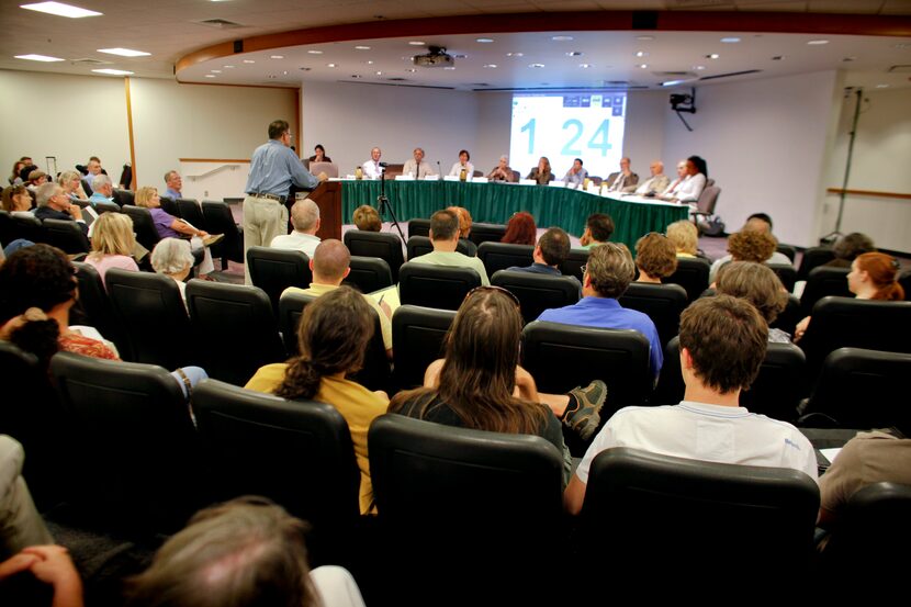 A full City Hall auditorium listens to Gary Stuard of Dallas speak against the possibility...