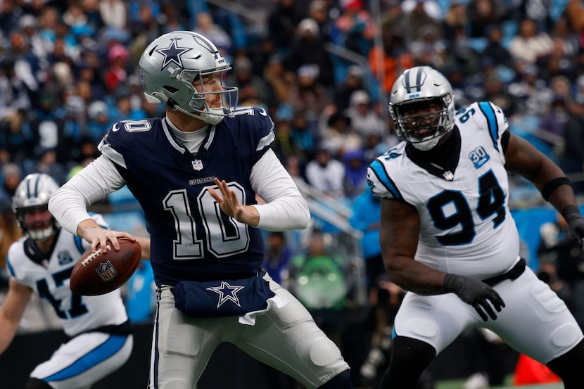 Dallas Cowboys quarterback Cooper Rush (10) looks to throw the ball as Carolina Panthers...