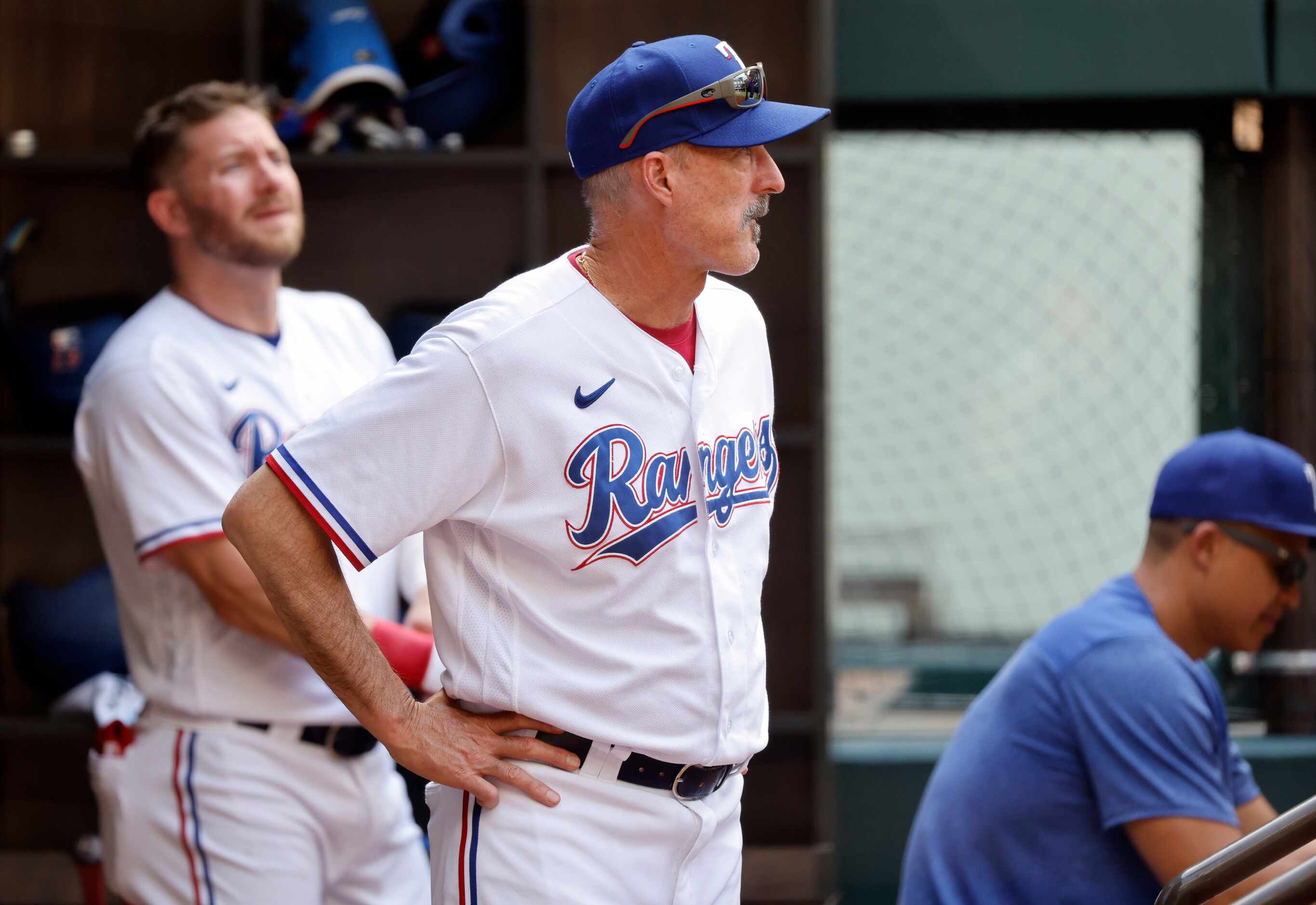 Texas Rangers pitching coach Mike Maddux watches as relief pitcher Yerry Rodriguez throws in...