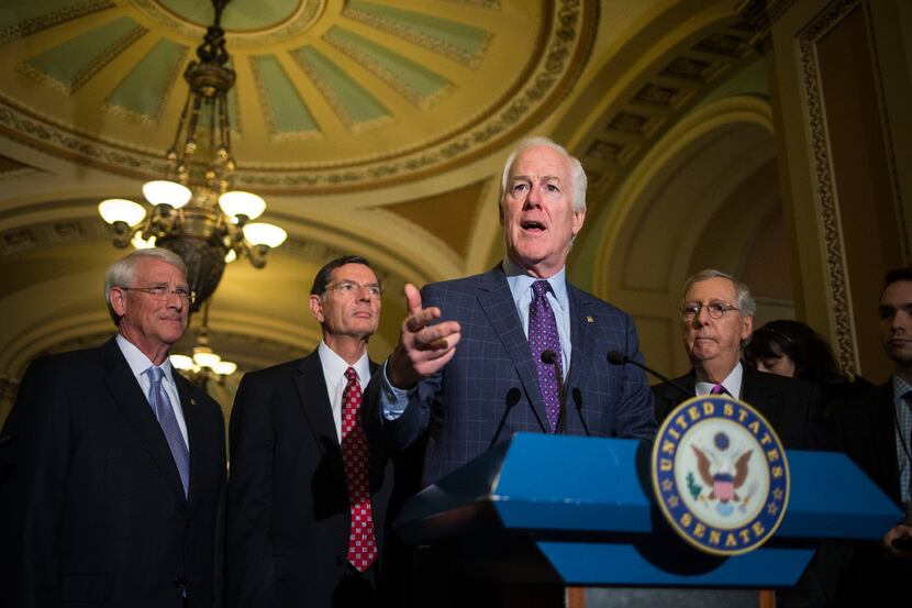 Senate Majority Whip John Cornyn, R-Texas, speaks to reporters after a weekly policy lunch...