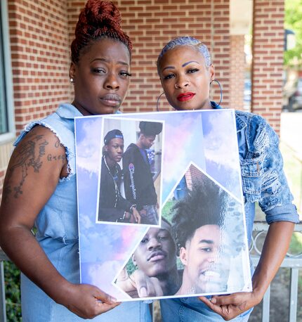 Kurtrice Coleman, left, and Nikki Beck, right,  pose with a photograph of their sons,...