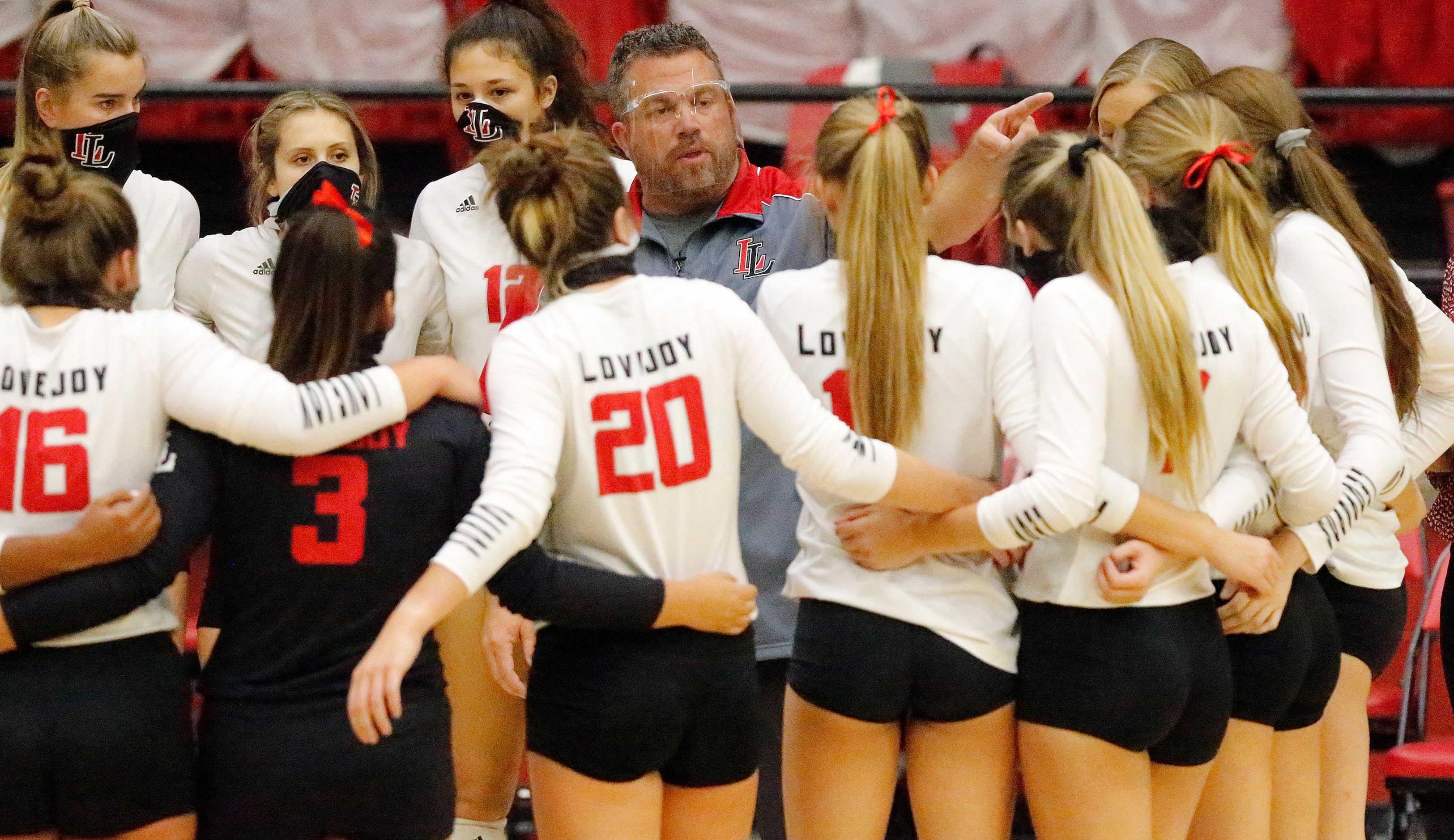 Lovejoy High School head coach Ryan Mitchell gives instruction in a time out during game one...