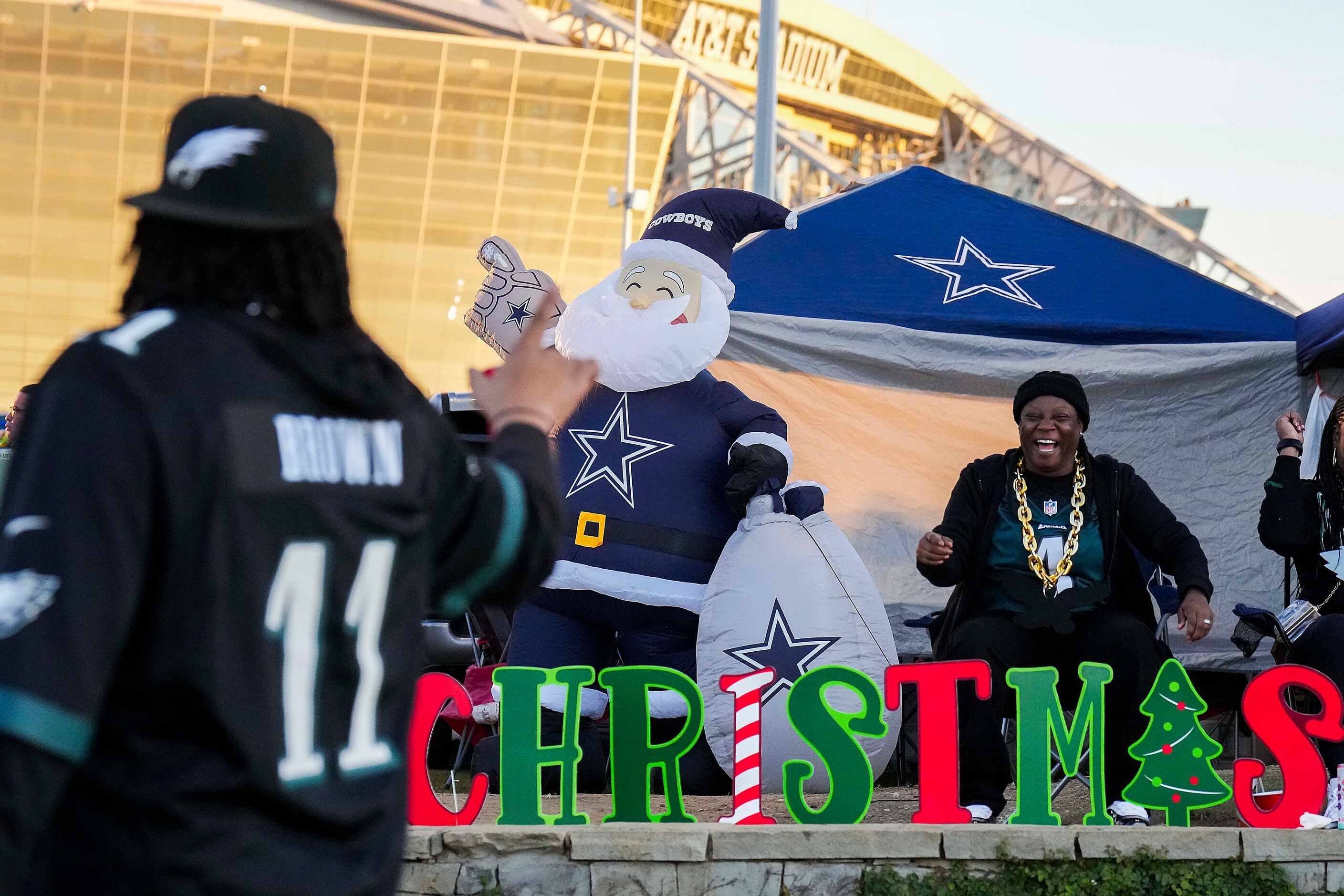 Philadelphia Eagles fan Tammy Mims of
Birmingham,  Ala., cheers with a fellow Eagles fan...