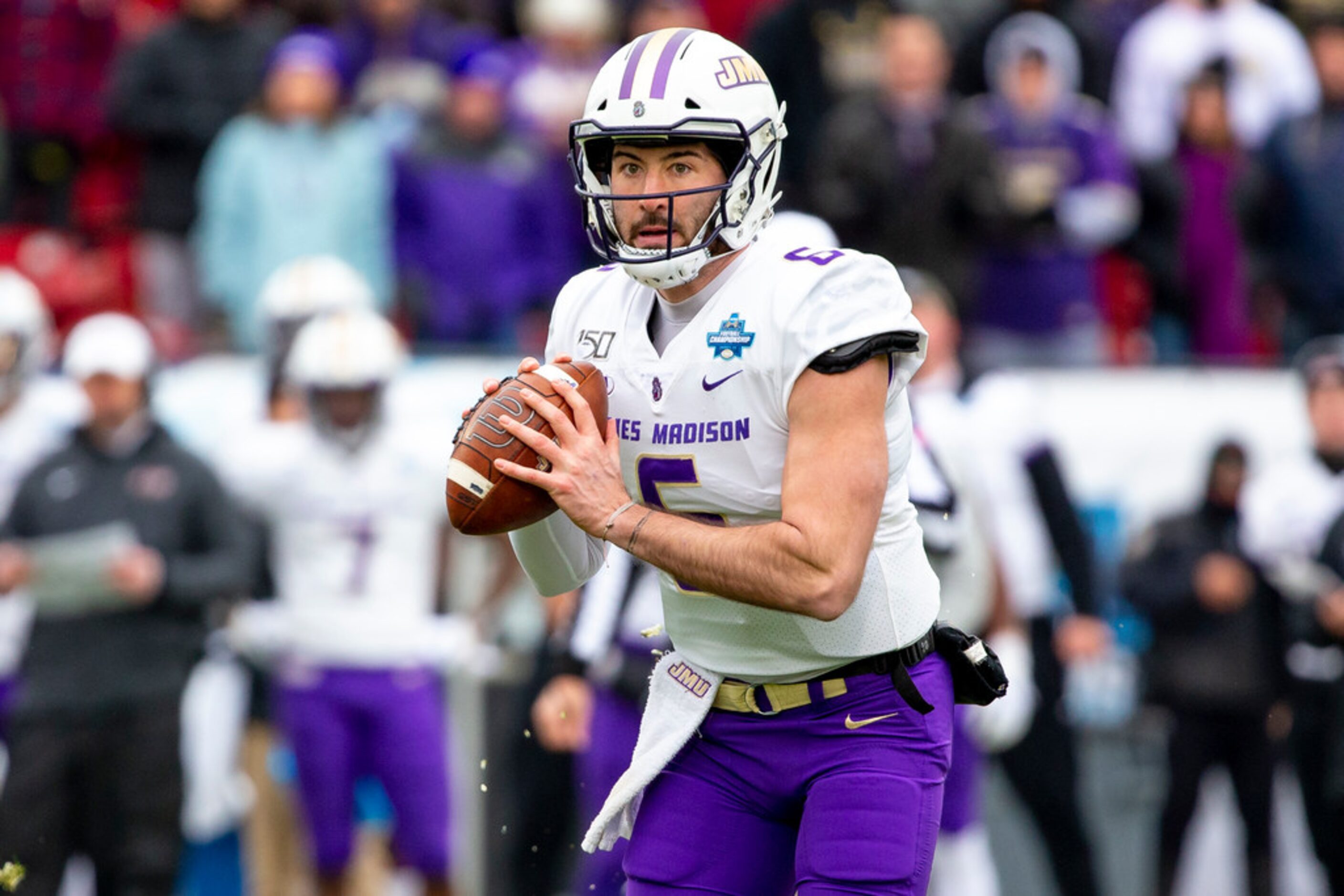 James Madison quarterback Ben DiNucci (6) looks to pass during the first half of the FCS...