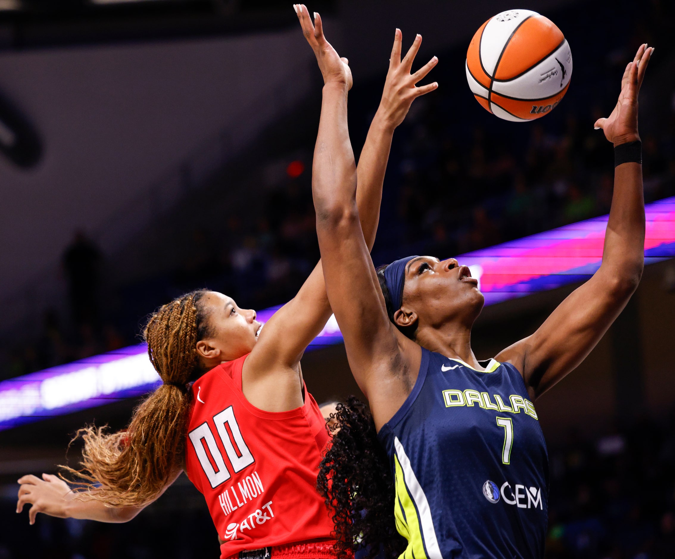 Dallas Wings center Teaira McCowan (7) and Atlanta Dream forward Naz Hillmon (00) jump to...