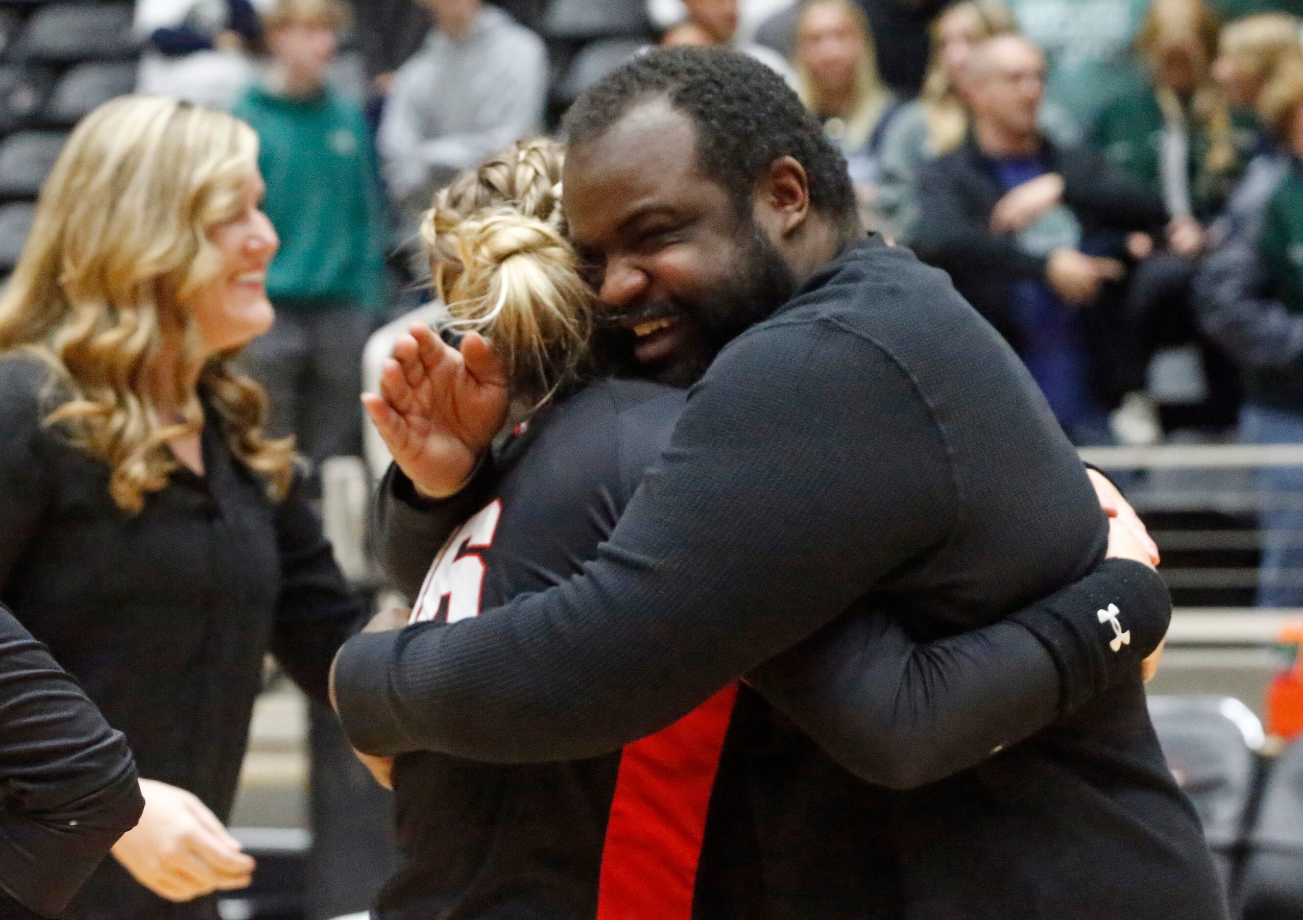 Colleyville Heritage High School's head coach Josh McKinney embraces Colleyville Heritage...