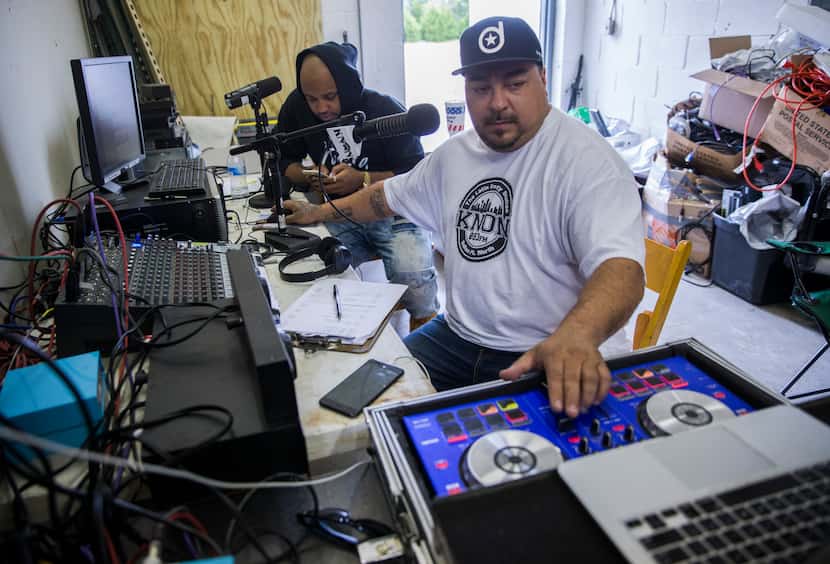 KNON DJs Ruben "Solo" Contreras (right) and Xavier Person, a.k.a. "Romeo X," host their...
