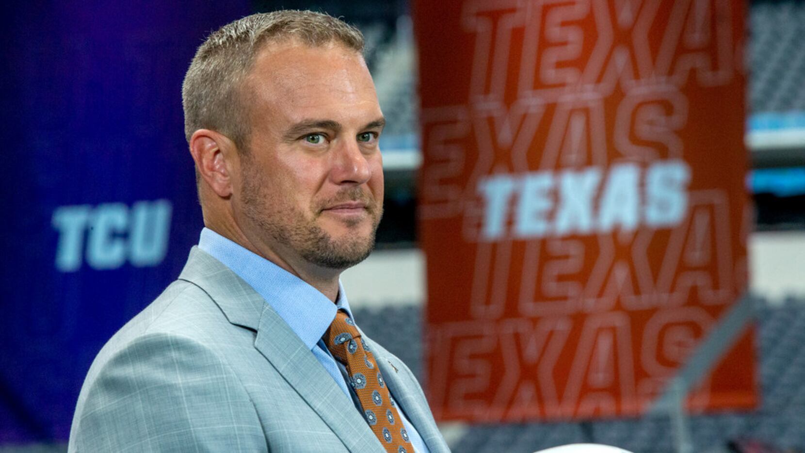University of Texas head football coach Tom Herman speaks with Fox Sports during the Big 12...
