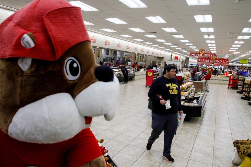 Jose Gonzalez walks by a large stuffed beaver at Buc-ee's in Terrell.