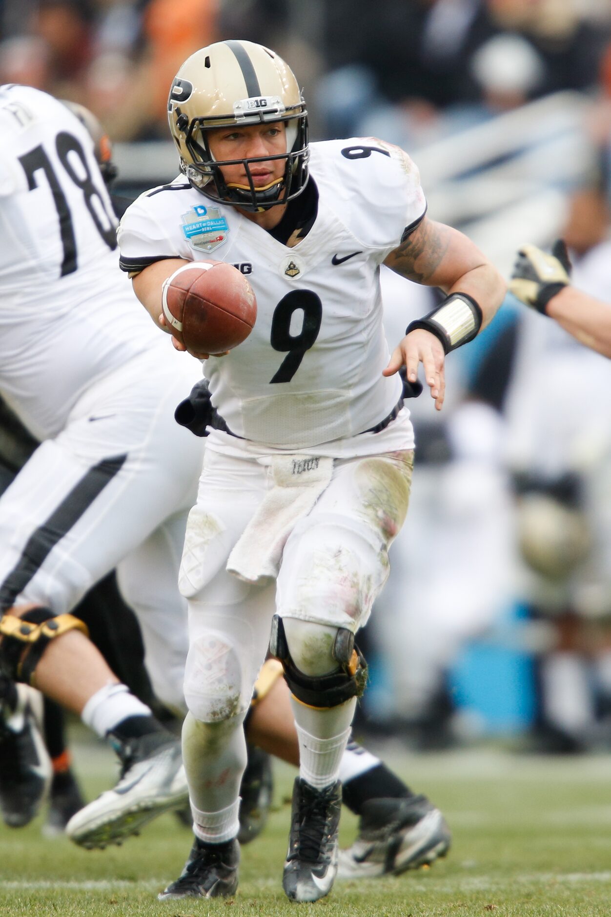 Purdue's quarterback Robert Marve (9) looks to hand the ball off during the inaugural Heart...