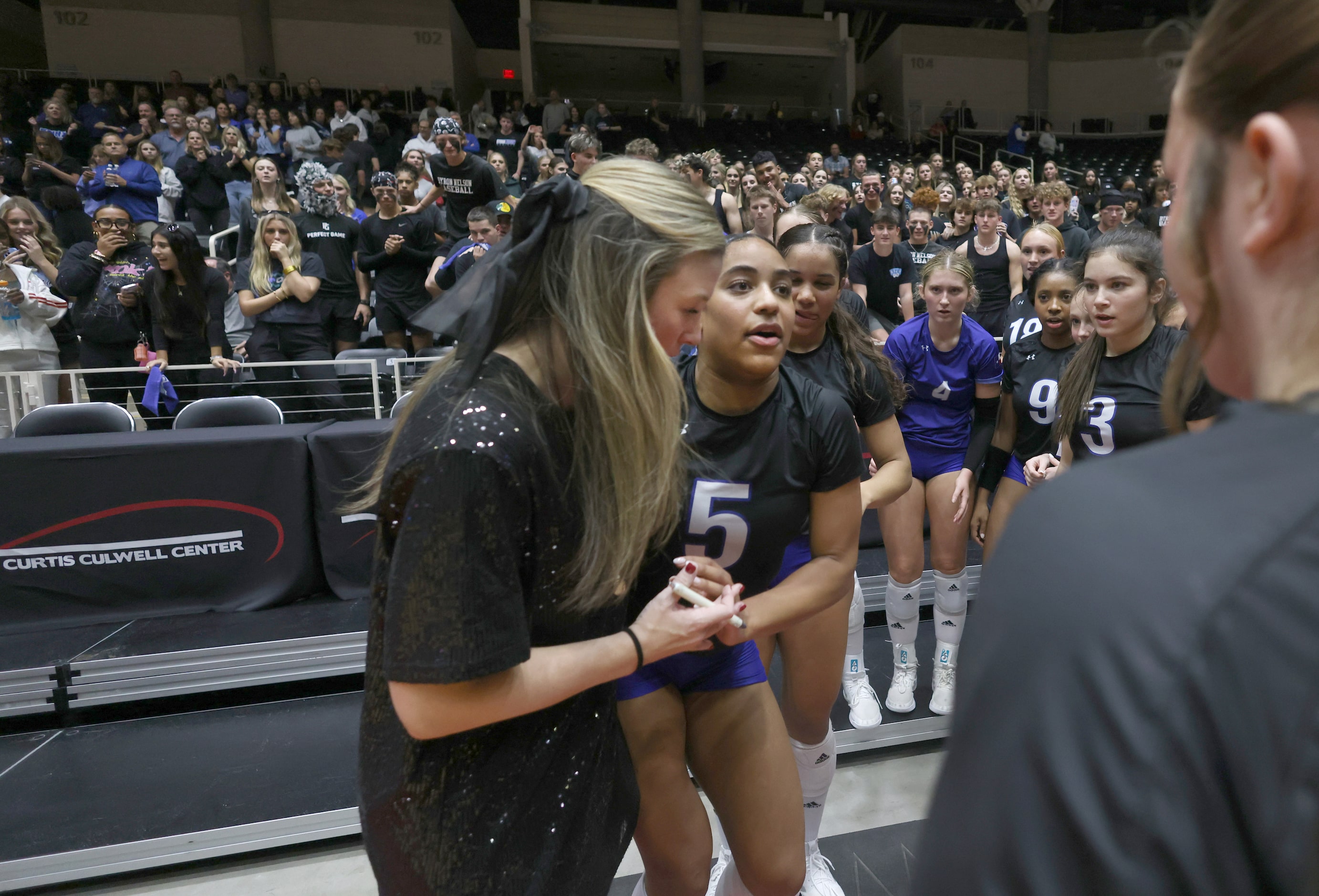 Byron Nelson Bobcats players and fans show concern after senior outside hitter Sydney...