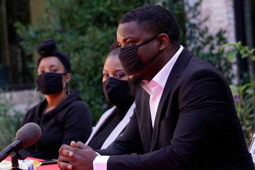 Dominique Alexander speaks during a news conference Monday in Dallas.