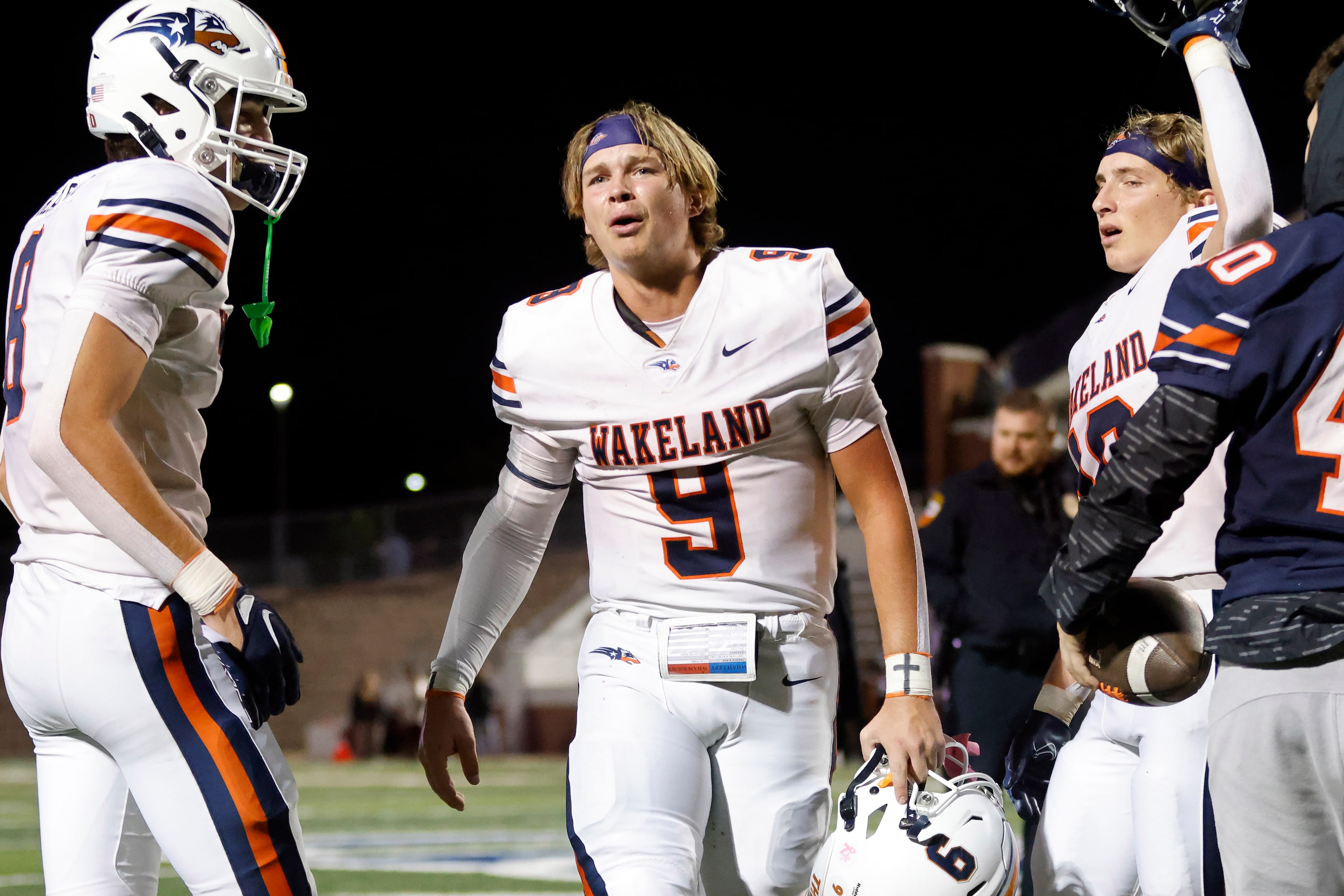 Frisco Wakeland quarterback Brennan Myer (9) is overcome with emotion following their Class...