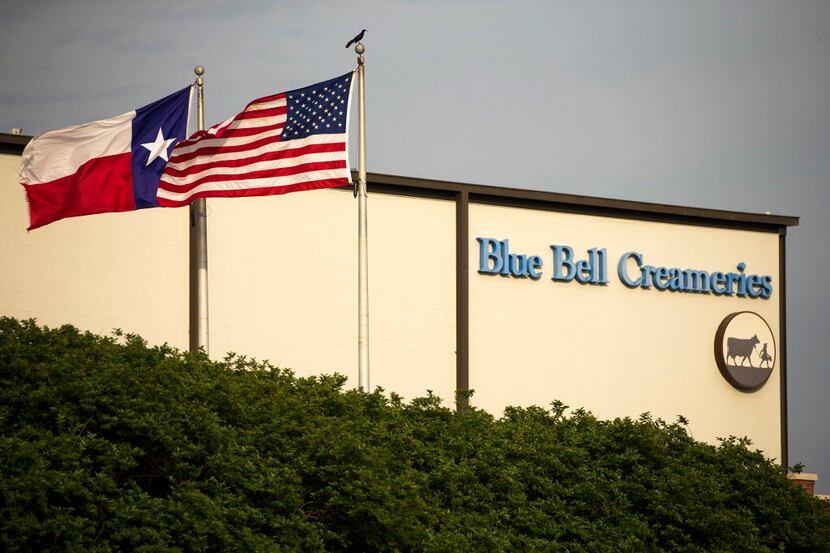  Flags flutter in the breeze outside of the Blue Bell Creameries on Thursday, April 23,...