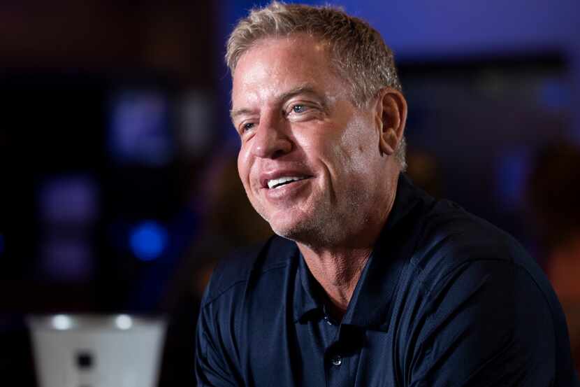 Former Cowboys quarterback Troy Aikman speaks to reporters at Katy Trail Ice House during a...