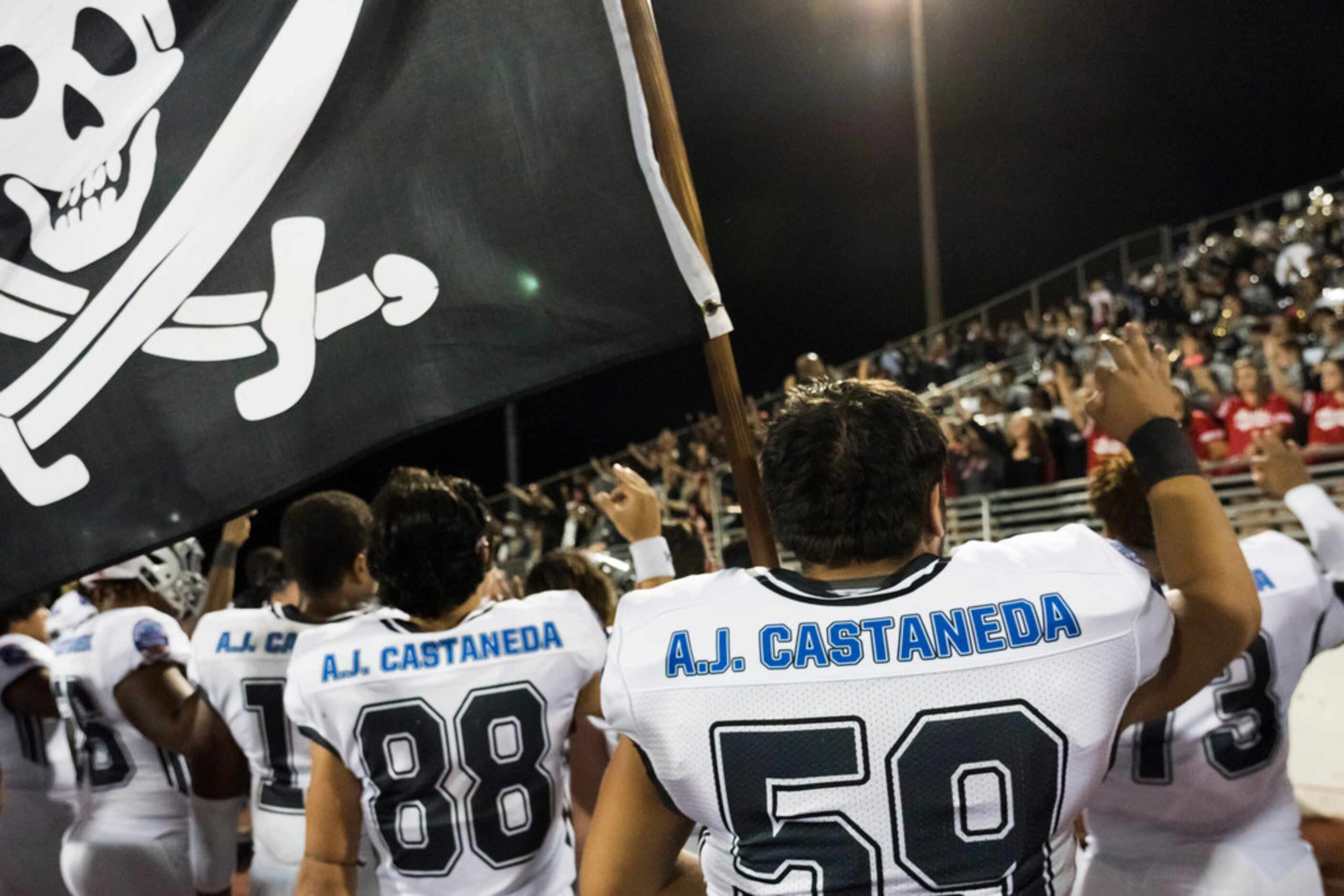 Arlington Martin players, including offensive lineman Humberto Rodriguez (59) wear jerseys...