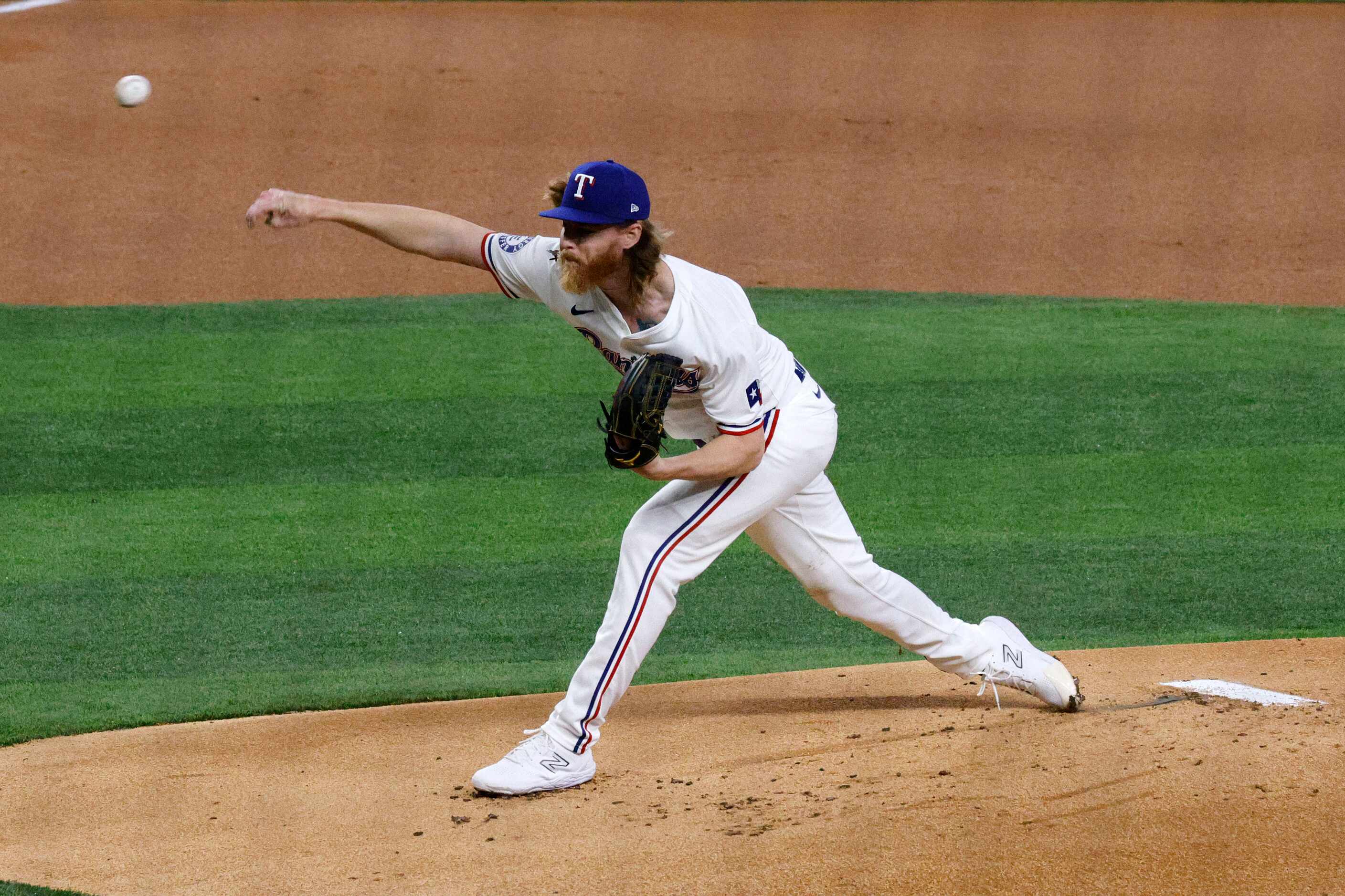 Texas Rangers pitcher Jon Gray (22) delivers during the first inning of a baseball game...
