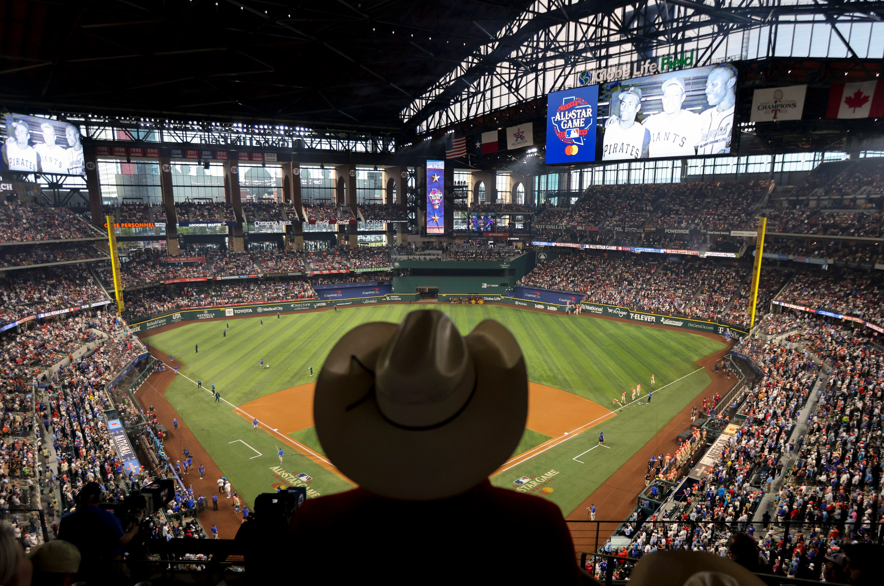 Patti Patak is silhouetted as she watches the MLB All-Star baseball game, on Tuesday, July...