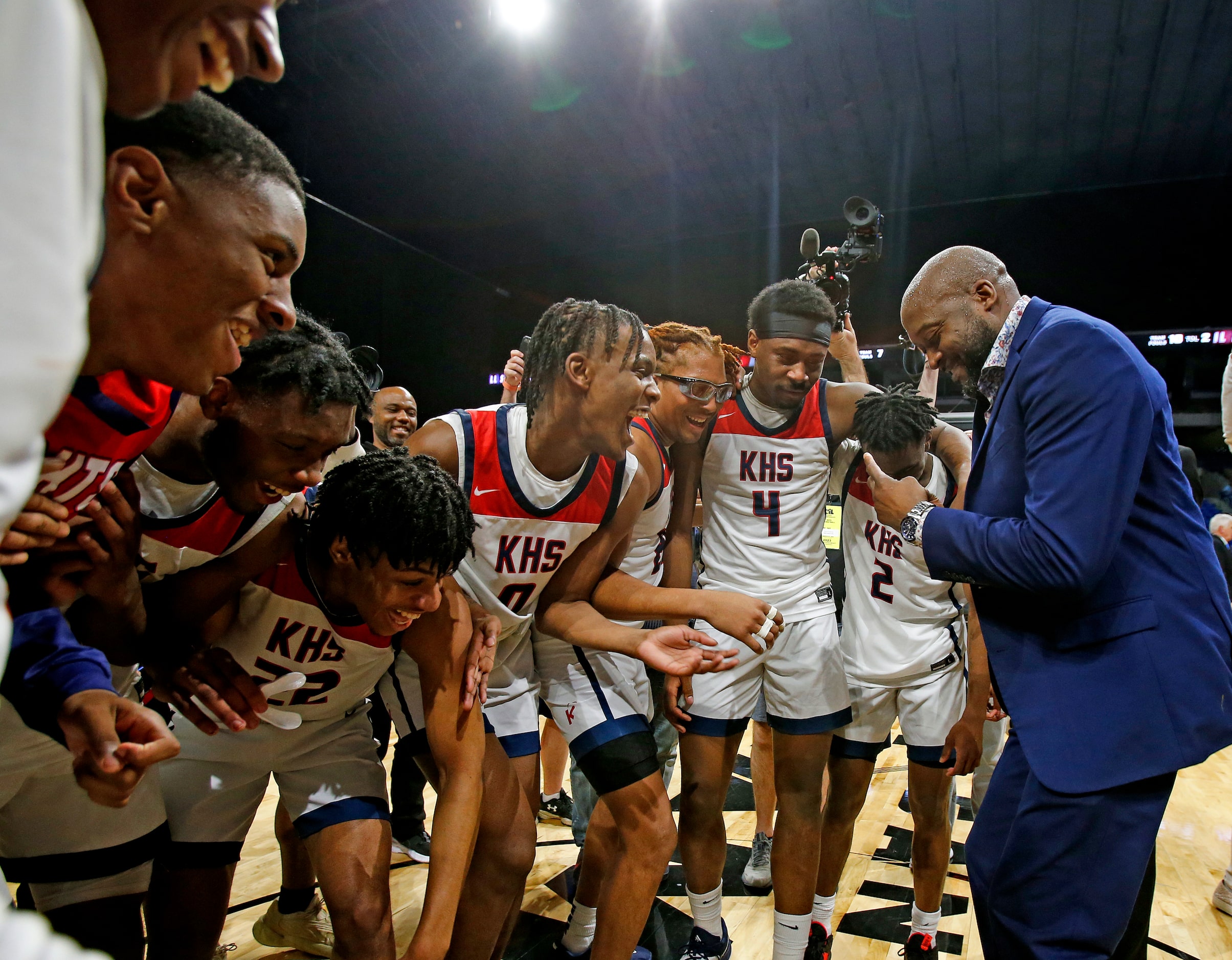 Dallas Kimball head coach Nicke Smith does a little jig for his team. Dallas Kimball...