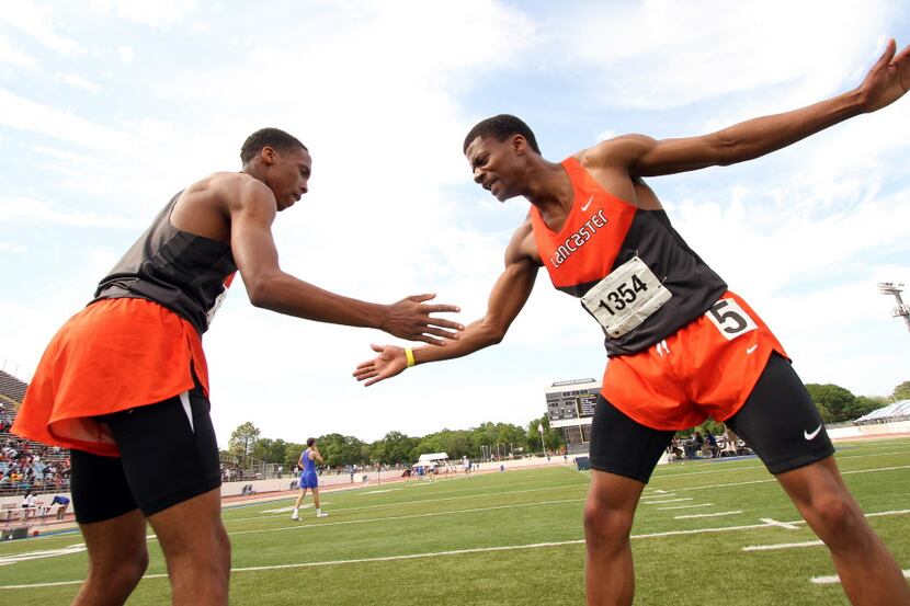 Lancaster's Eric Age, left, and Desmond Anderson celebrate after Anderson won the Boys 400...