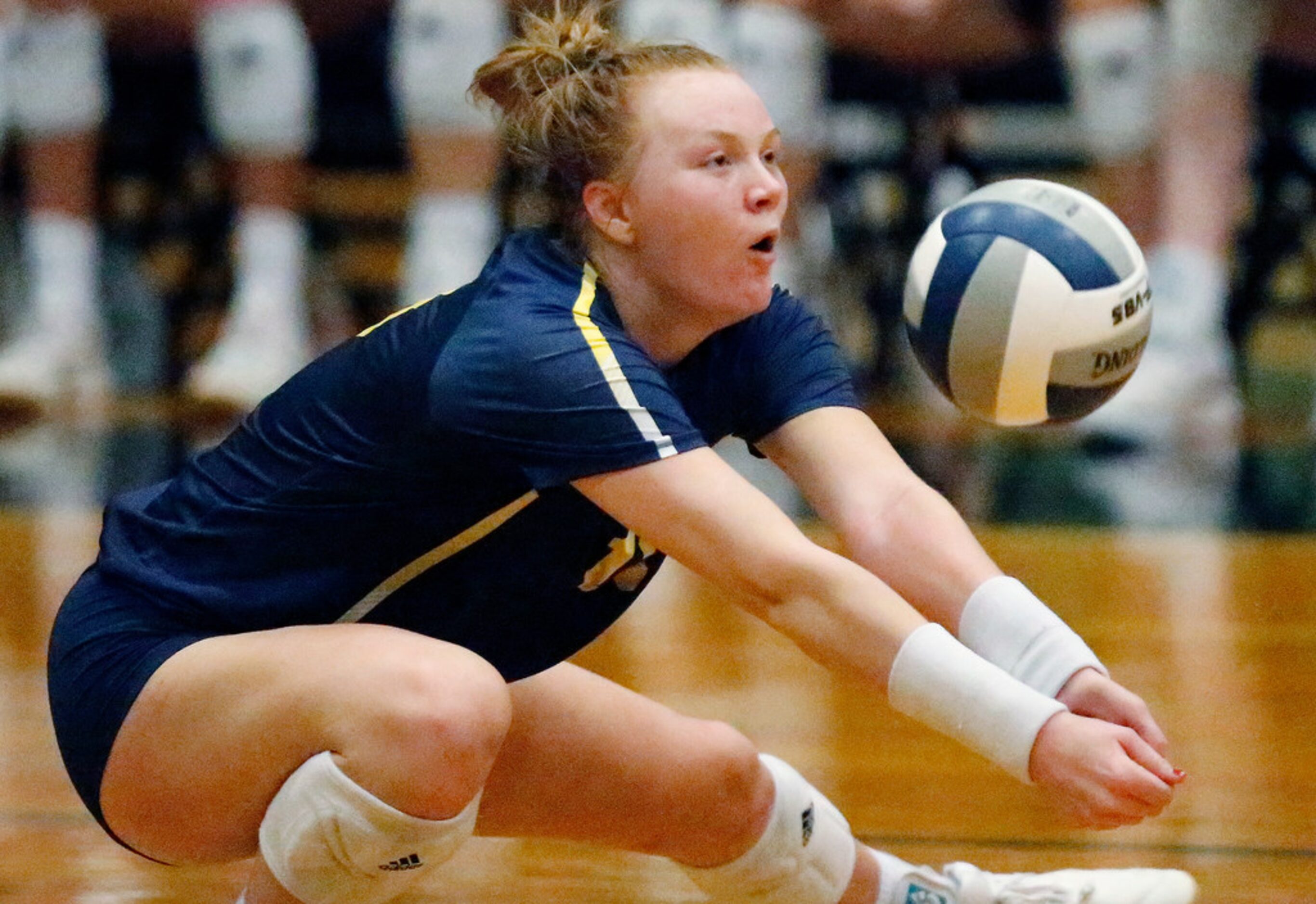 Highland Park High School outside hitter Kendyl Reaugh (18) gets dig in game two as Lovejoy...