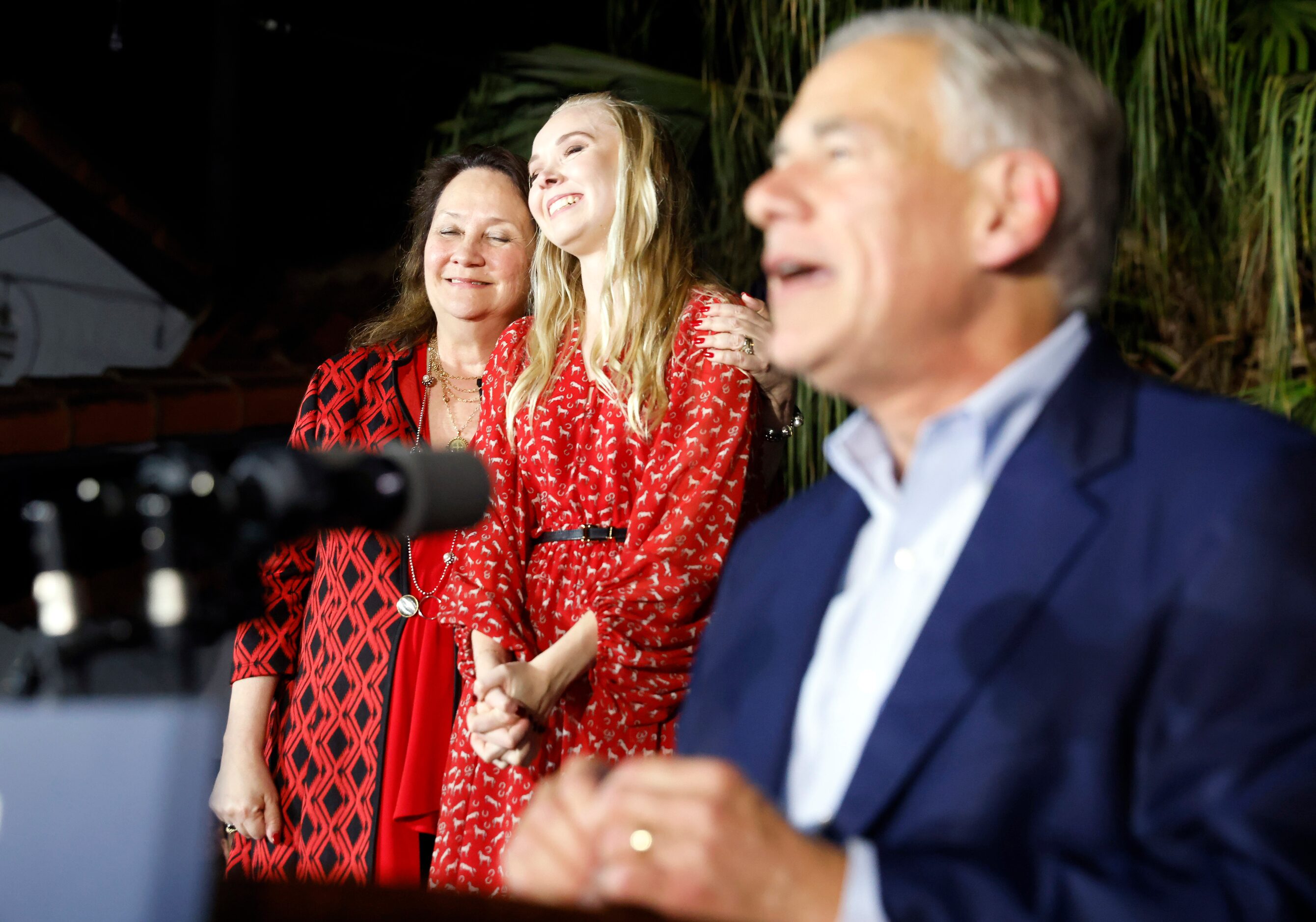 Cecilia Abbott hugs her daughter Audrey after being introduced by Texas Governor Greg Abbott...