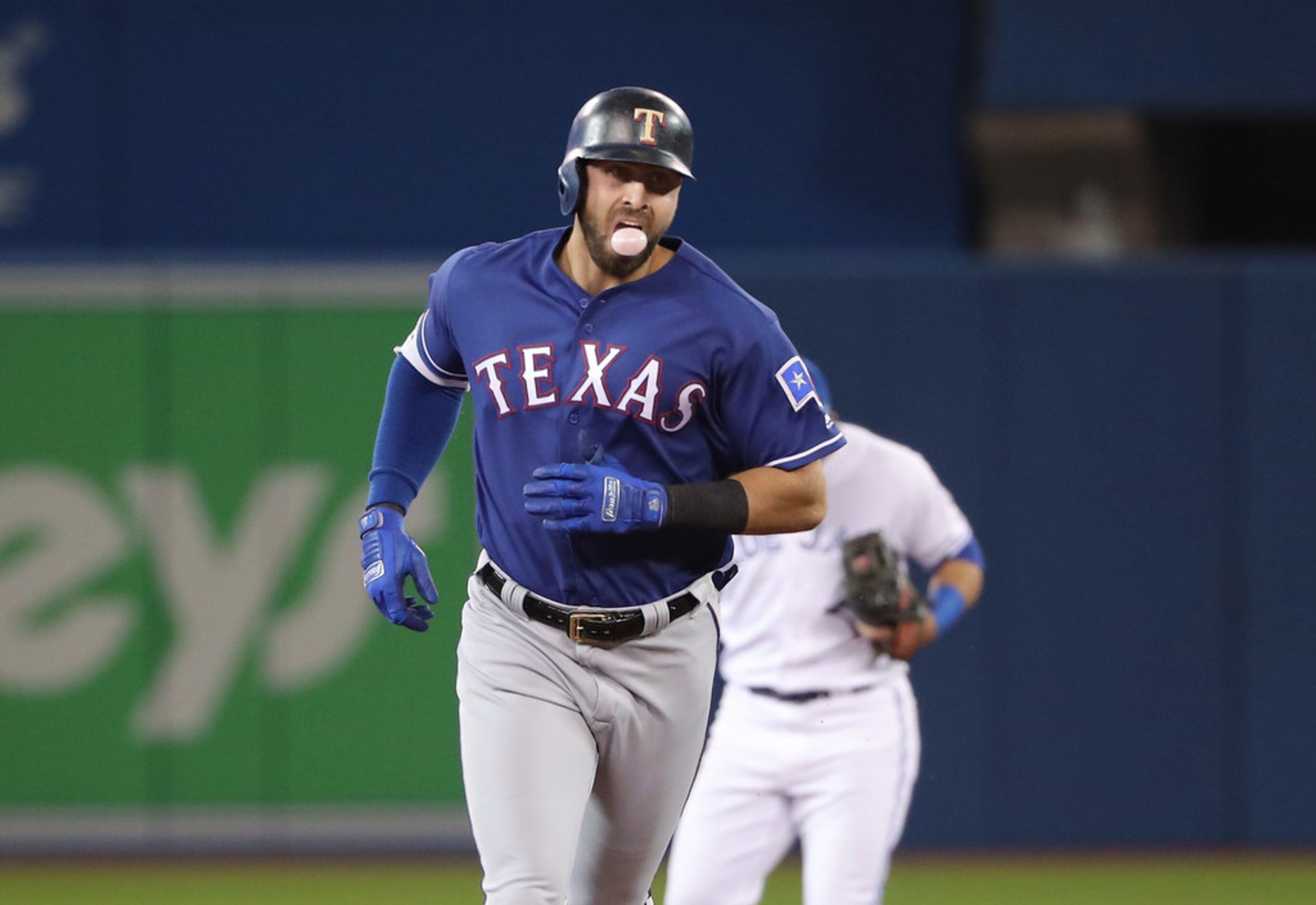 TORONTO, ON - APRIL 27: Joey Gallo #13 of the Texas Rangers circles the bases after hitting...