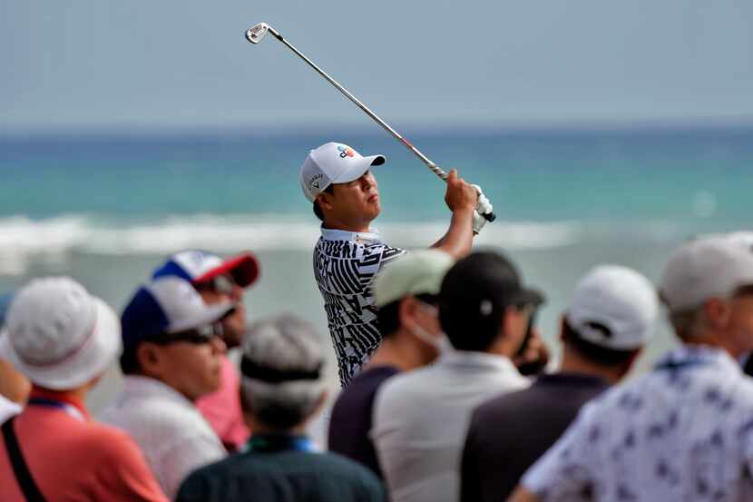 Si Woo Kim plays his shot from the 17th tee during the final round of the Sony Open golf...