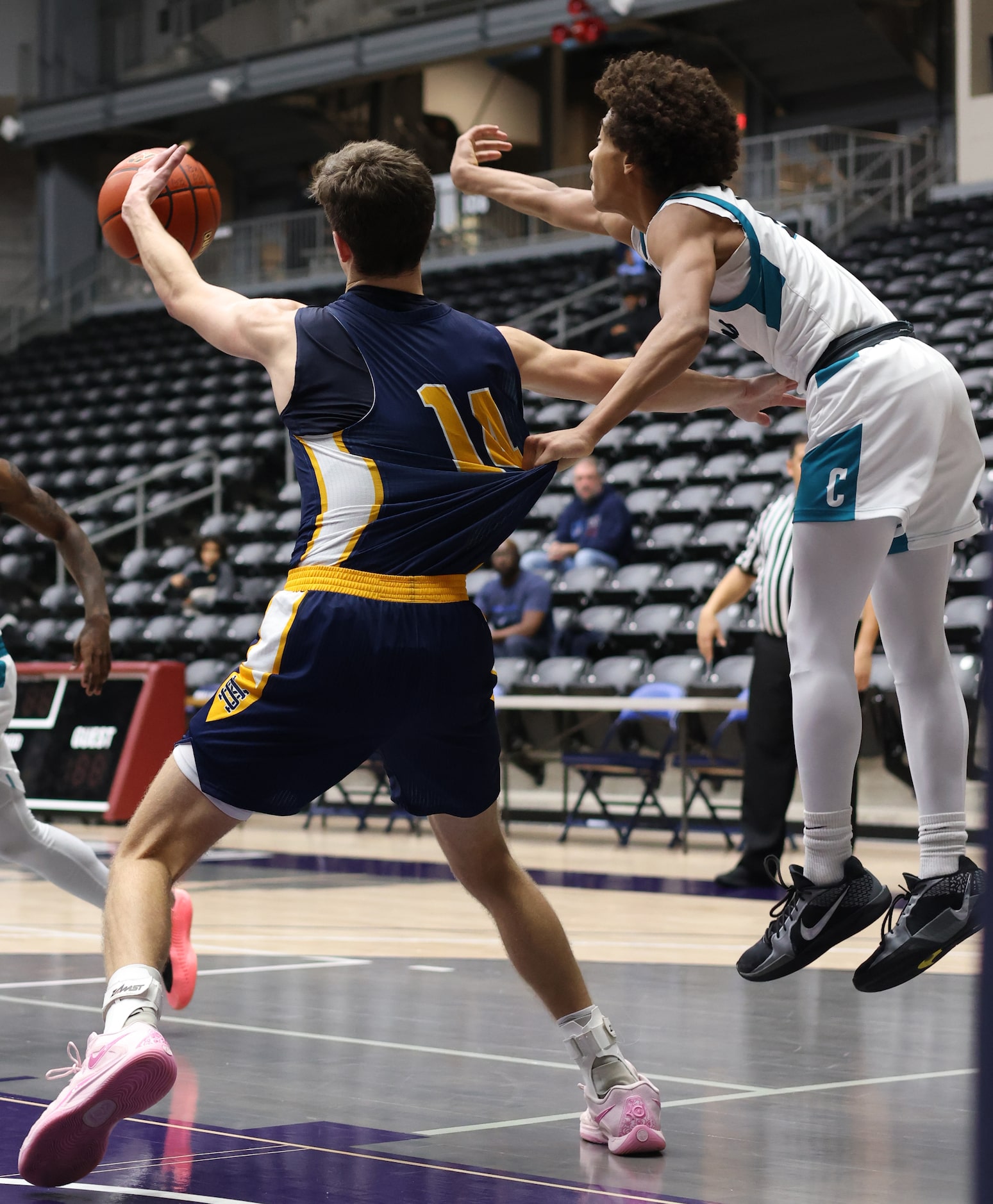 Frisco Panther Creek guard Rodney Wagner (11), right, leaps and grabs a handful of jersey as...