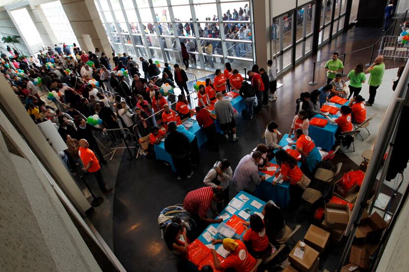  In 2013, people lined up in Dallas for a health fair sponsored by Blue Cross Blue Shield of...