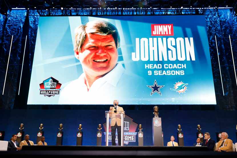 Pro Football Hall of Fame inductee Jimmy Johnson of the Dallas Cowboys (left) delivers his...