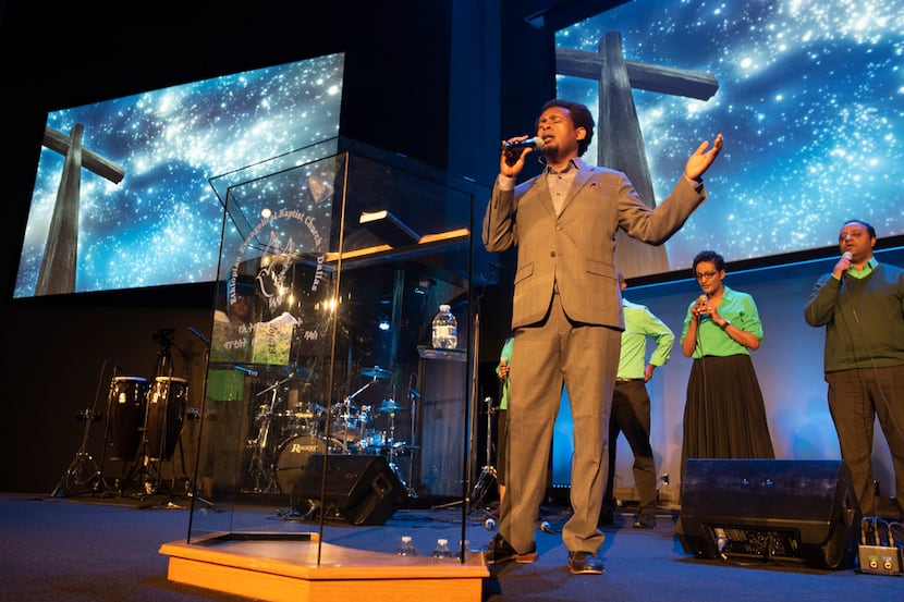Daniel Amdemichael, worship director at Ethiopian Evangelical Baptist Church, sings during a...