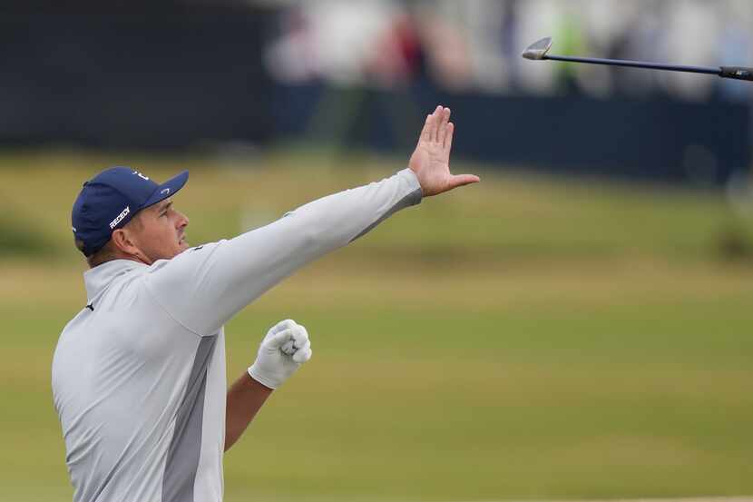 Bryson DeChambeau of the US catches his club during a practice round at the British Open...