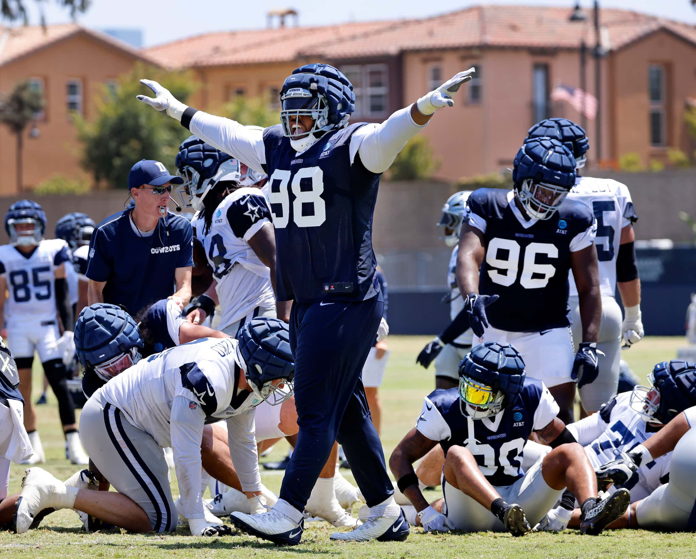 Dallas Cowboys defensive tackle Carl Davis (98) celebrates the defensive stop as the run...