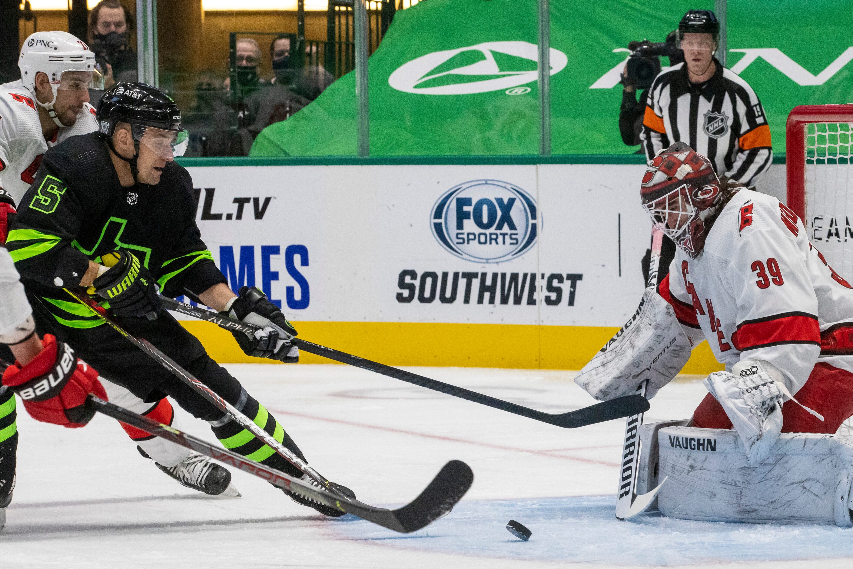 Dallas Stars defenseman Andrej Sekera (5) attempts an assist to score against Carolina...