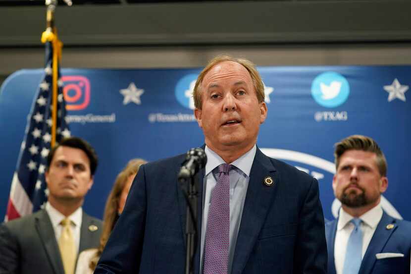 Texas state Attorney General Ken Paxton reads a statement at his office in Austin, Friday,...