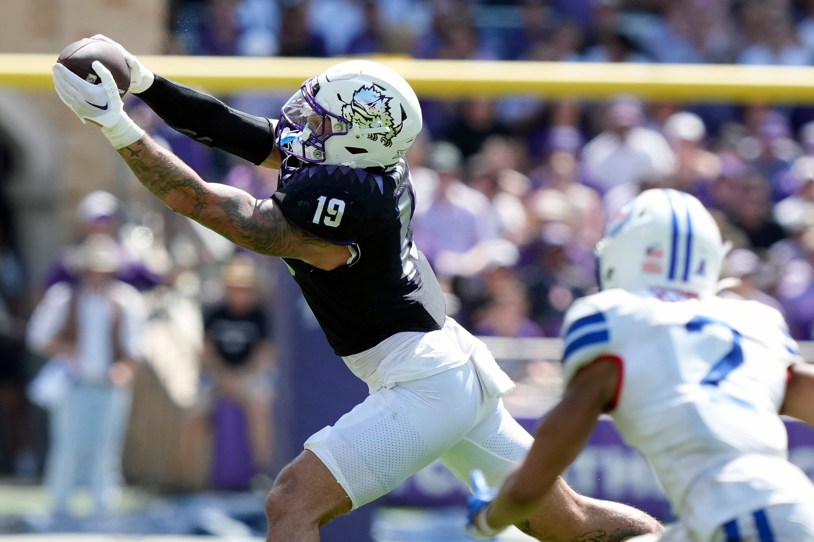 TCU tight end Jared Wiley (19) catches a pass in front of SMU safety Jonathan McGill (2)...