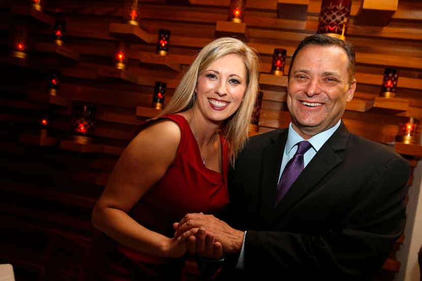 Ericka Downey (left) talks to Texas Tech coach Billy Gillispie pose for a portrait during a...