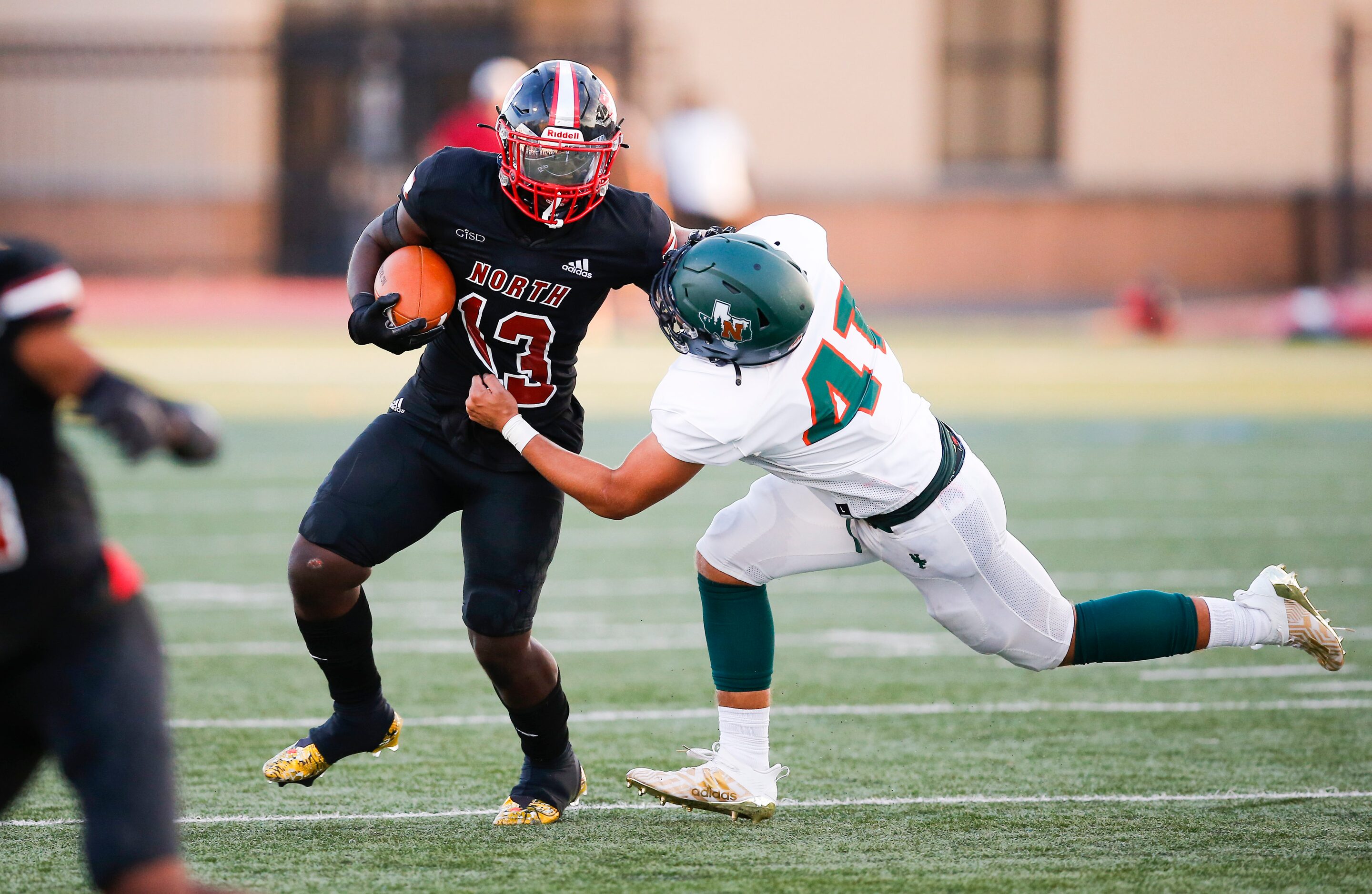 Garland Naaman Forest senior linebacker Chandler Davis (41) tackles North Garland sophomore...