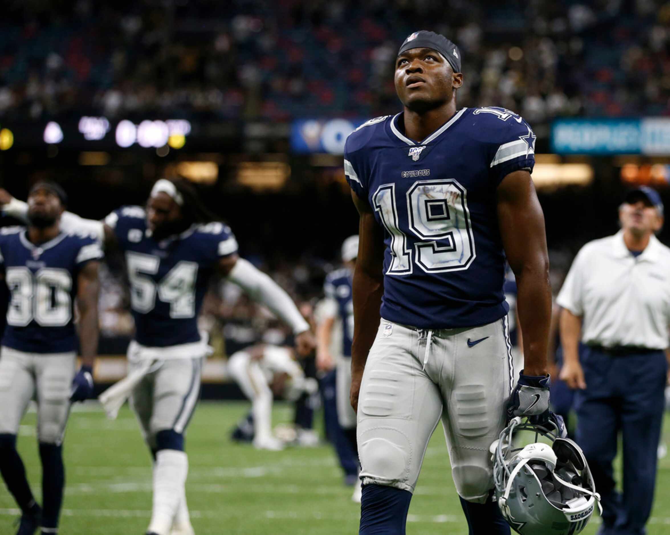 Dallas Cowboys wide receiver Amari Cooper (19) exits the field after losing to the New...