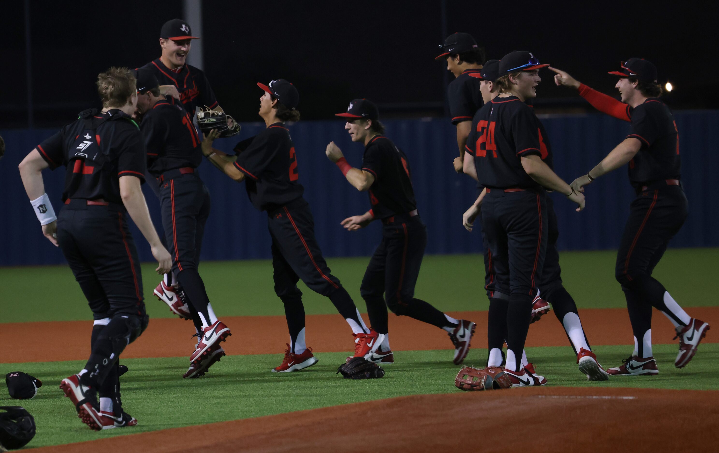 Lovejoy players celebrate on the field following their 7-1 victory over Frisco to advance....