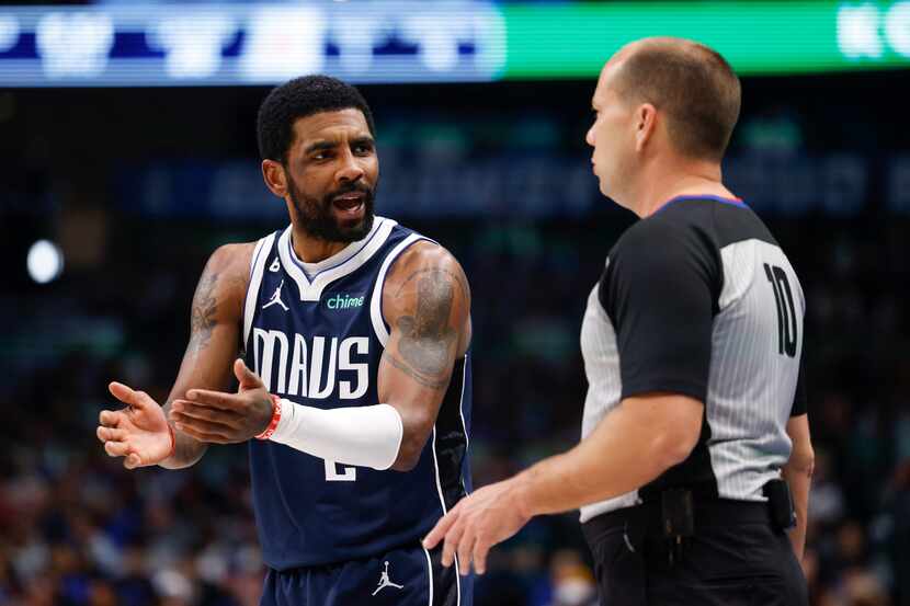Dallas Mavericks guard Kyrie Irving (2) talks with referee John Goble (10) during the first...