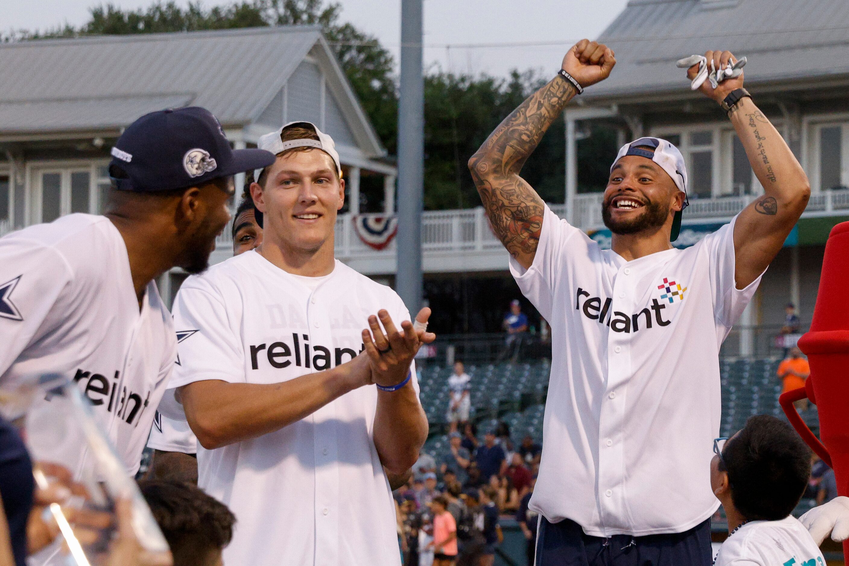 Dallas Cowboys quarterback Dak Prescott (right) reacts alongside Leighton Vander Esch...