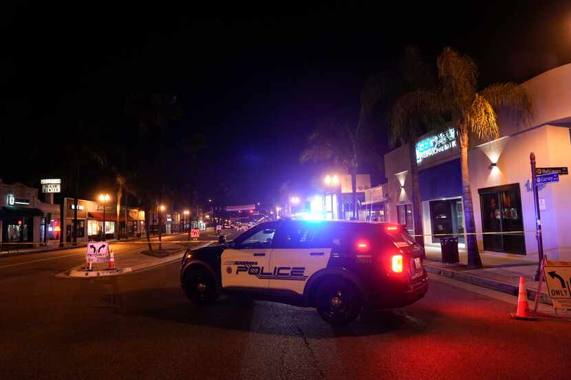 A police vehicle blocked the street near where a shooting took place in Monterey Park,...