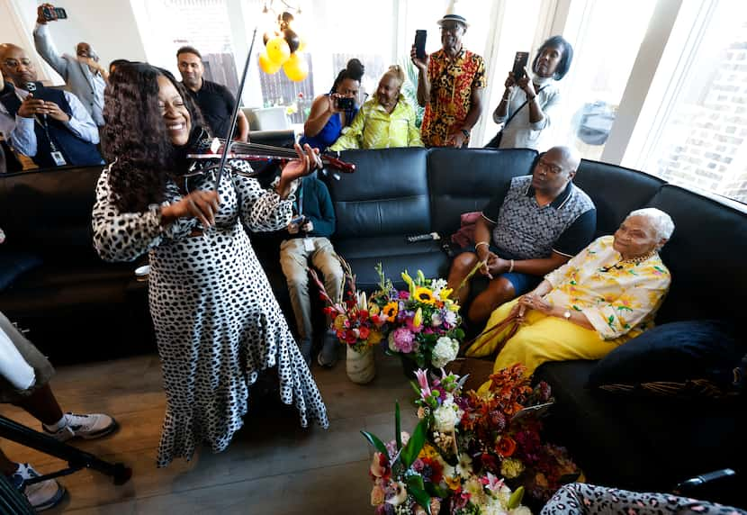 Violinist Shondalla Calder performs Lizzo’s "Birthday Girl" for Viola Fletcher (right), one...