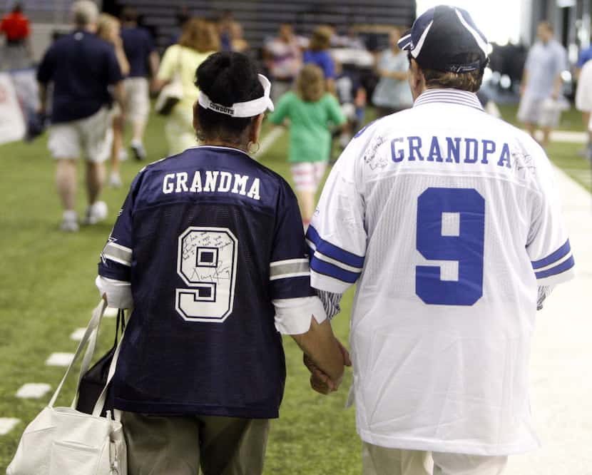 Felicita Romo and Ramiro Romo Sr., Tony Romo's grandparents, make their way off the field...