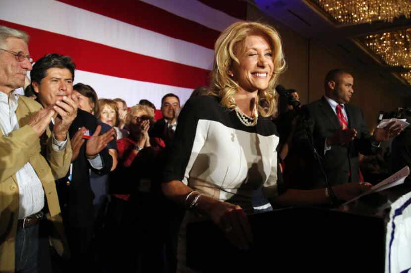Newly elected Texas State Senator Wendy Davis, winks at a supporter during the Tarrant...