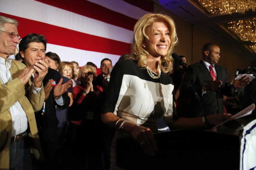 Newly elected Texas State Senator Wendy Davis, winks at a supporter during the Tarrant...