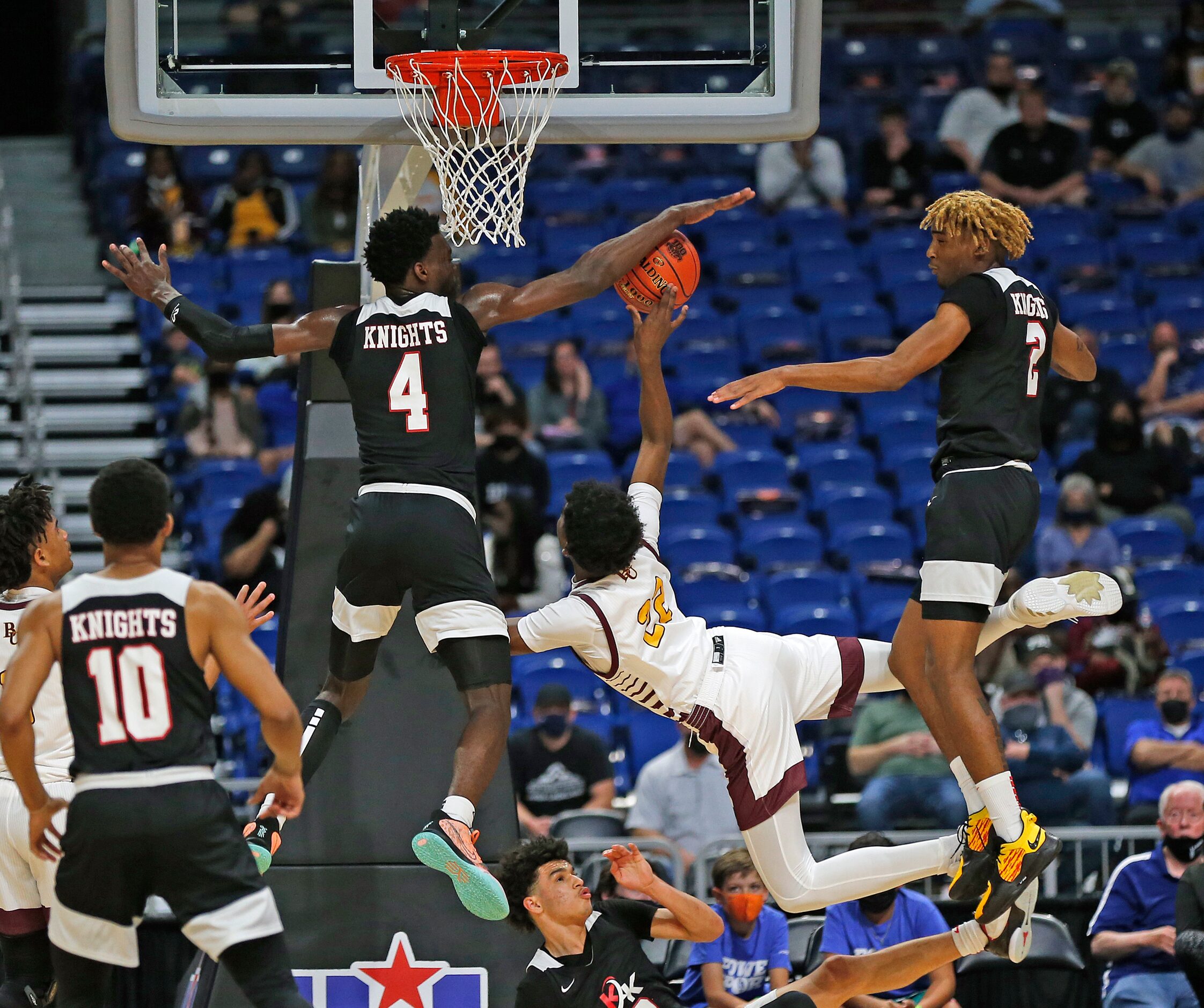 Dallas Kimball Kyron Henderson #4 blocks shot of Beaumont United Clarence Paiya #22. UIL...